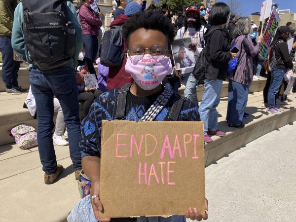 Camden Hunt said she came out to the rally Saturday to “show Black and Asian solidarity.” (Kate Brumback/Associated Press)