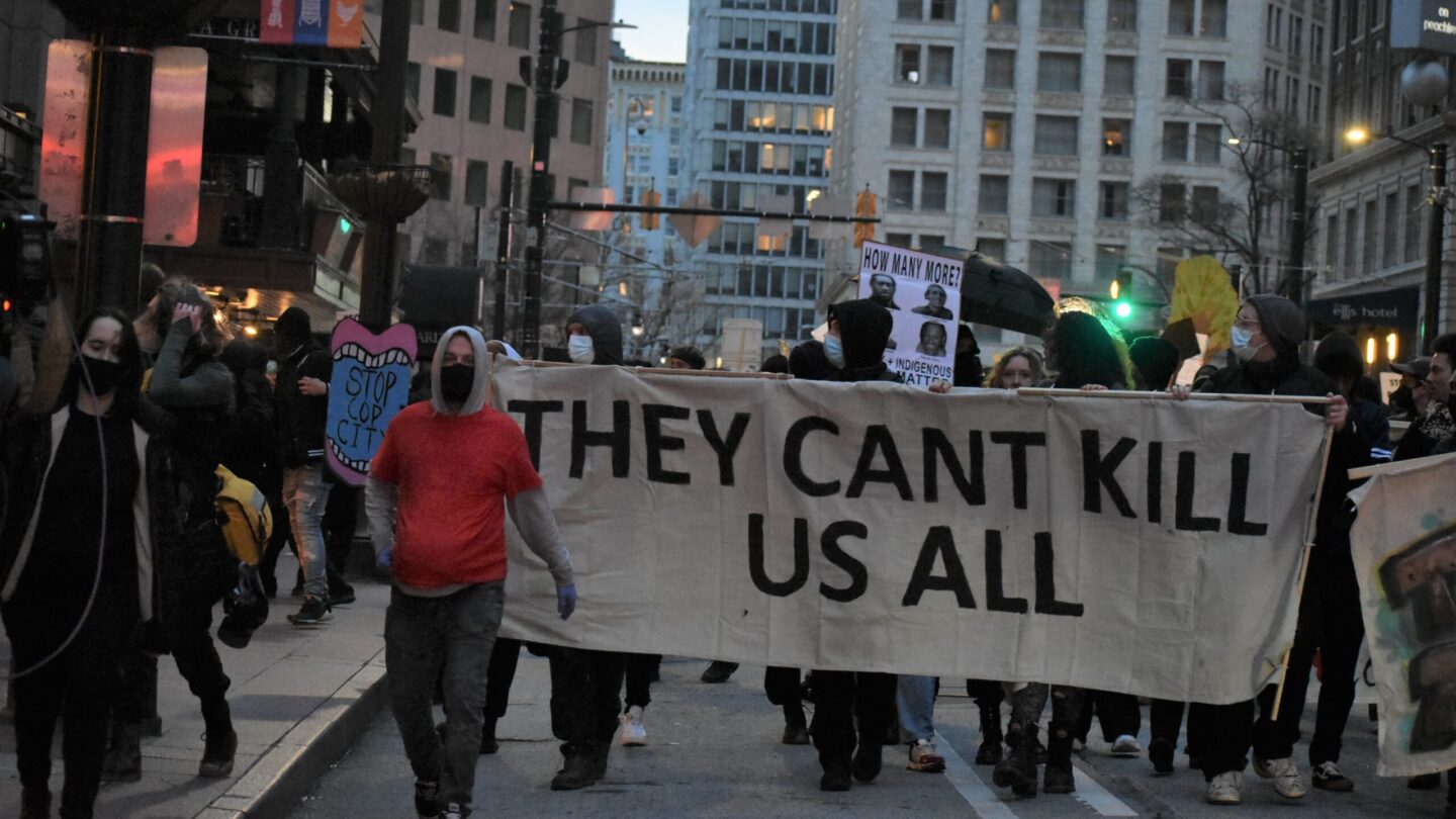 Protesters holding sign saying They Cant Kill Us All