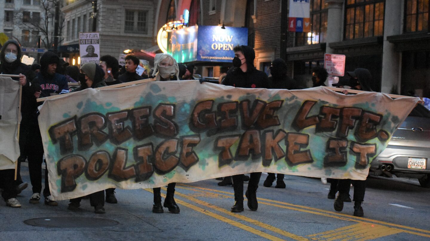 Protests holding sign