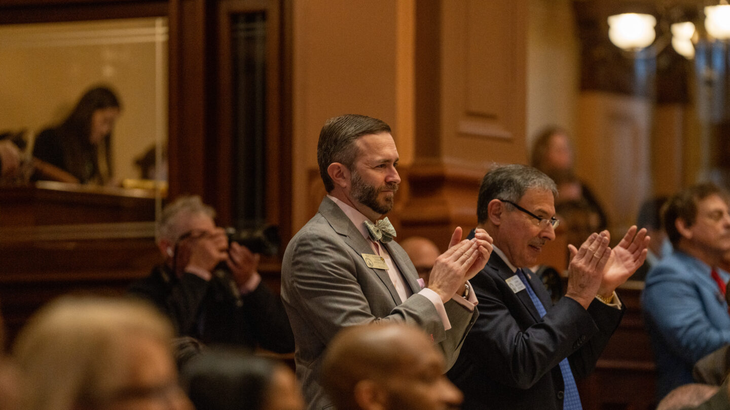 Lawmaker standing clapping