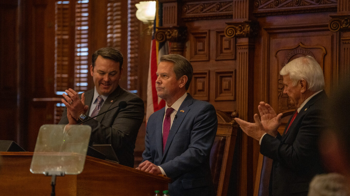 Gov. Brian Kemp flanked by Lt. Gov. Burt Jones (left) and House Speaker Jon Burns (right) at the 2023 State of the State address.