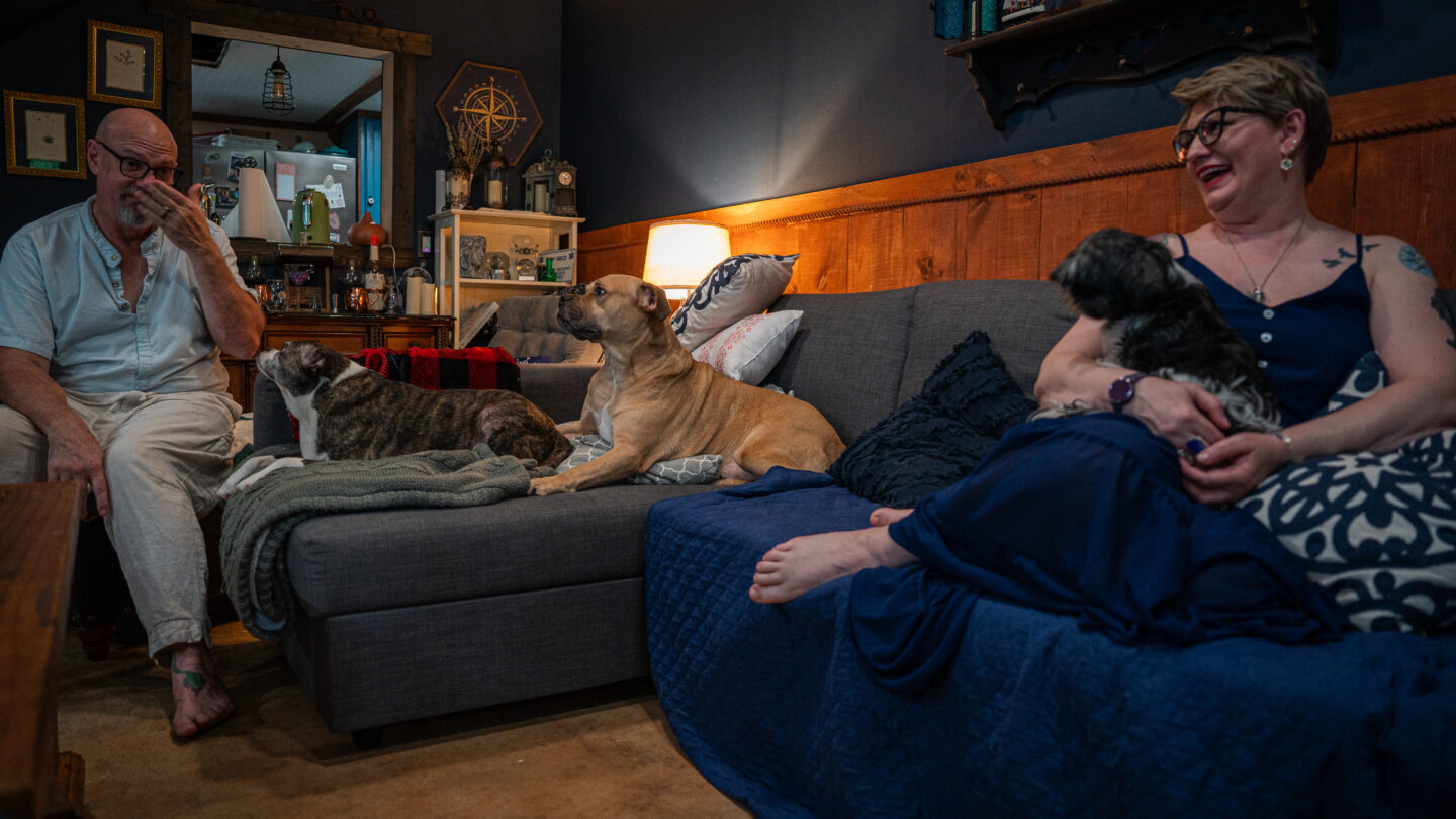 Couple and dogs on couch