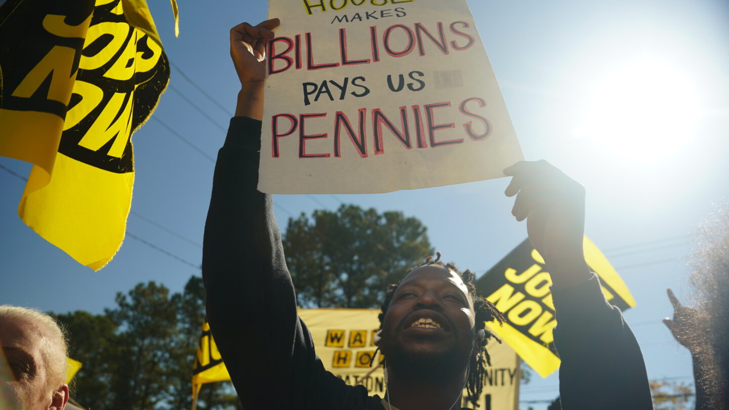 Waffle House workers rally outside of headquarters in Norcross for