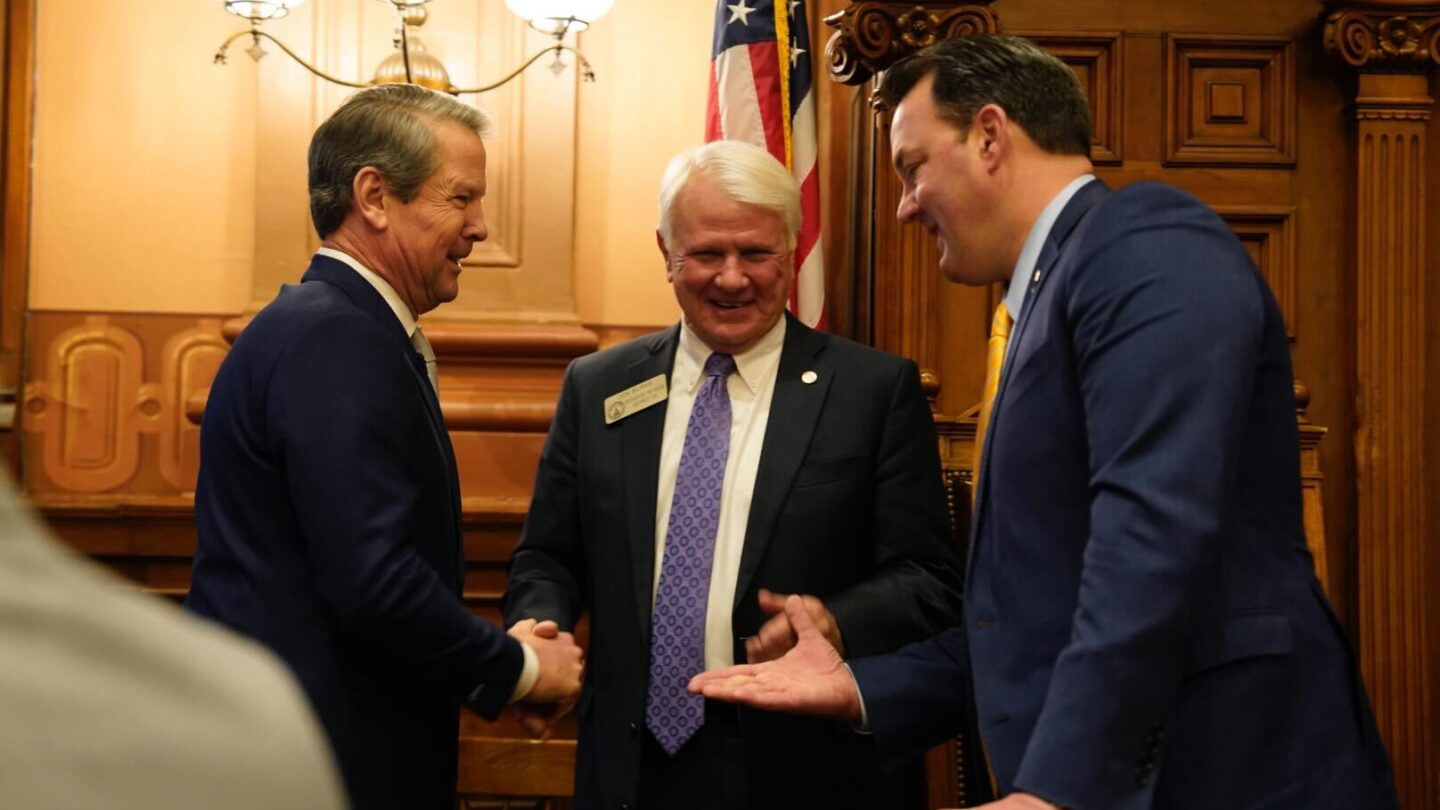 Georgia Gov. Brian Kemp greets House Speaker Jon Burns and Lt. Gov. Burt Jones