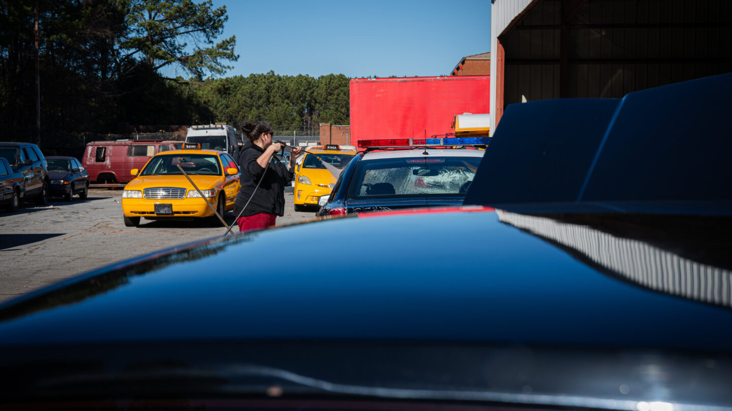 Woman cleaning car