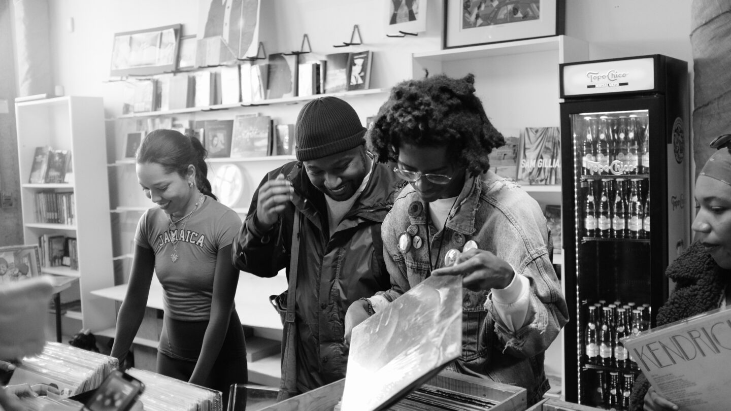 Smiling people looking at records