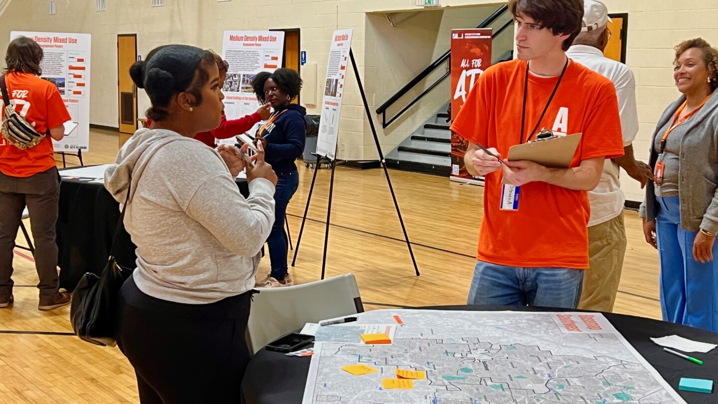 Young girl speaking with man at event