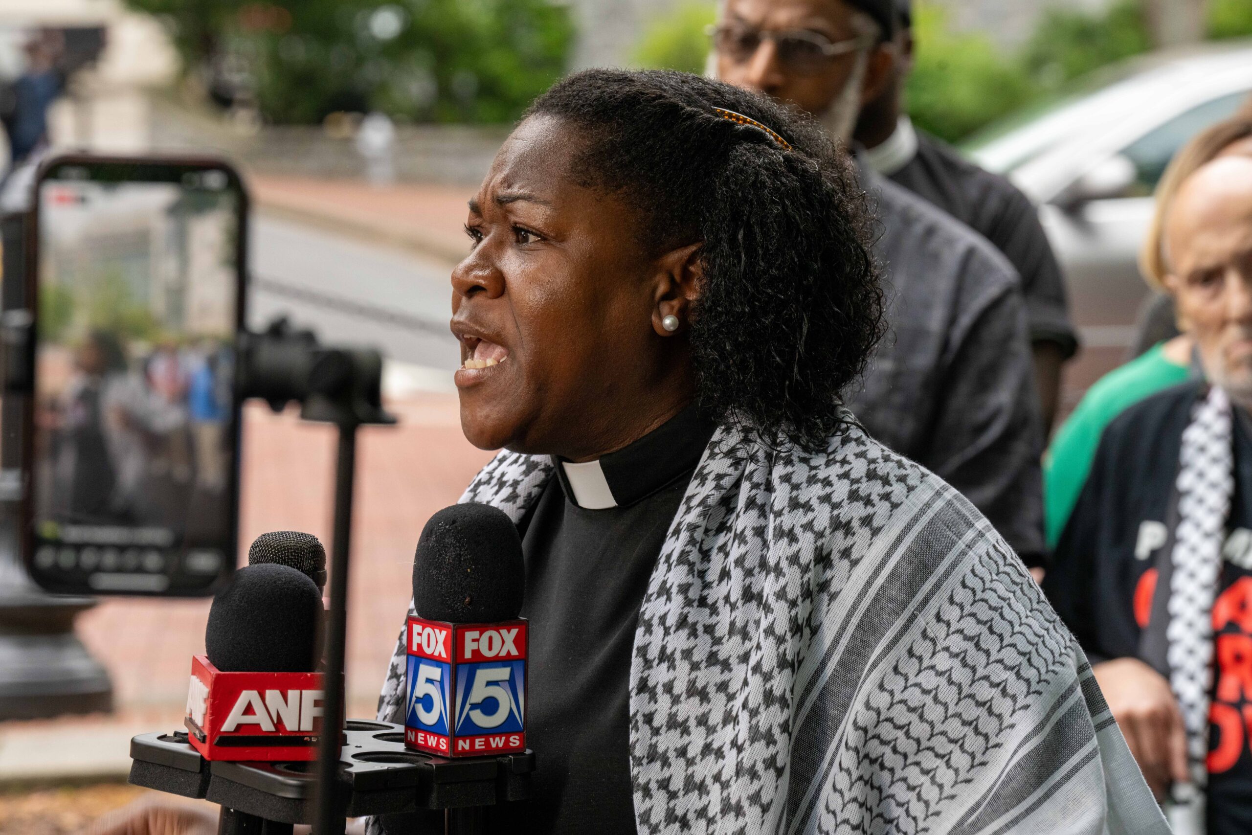 Faith leader Rev. Keyanna Jones, a co-pastor at Park Avenue Baptist Church in Atlanta’s Grant Park, speaks during a press conference on the Emory University campus on Tuesday, April 30, 2024.