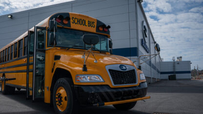 A new electric school bus in front of Blue Bird’s plant in Fort Valley, Georgia.