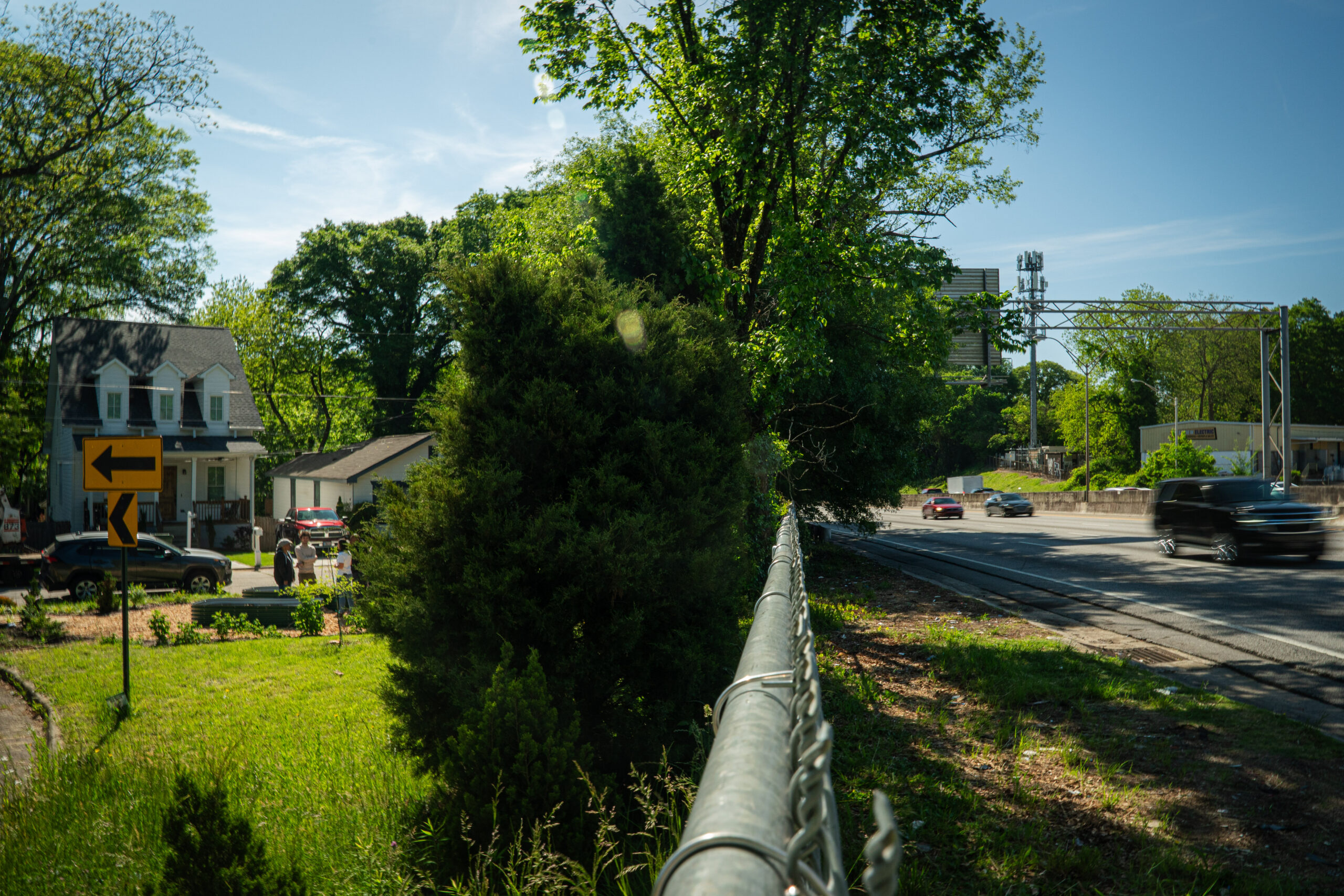 A chainlink fence is all that separates I-20 and the historic Mozley Park neighborhood in southwest Atlanta.