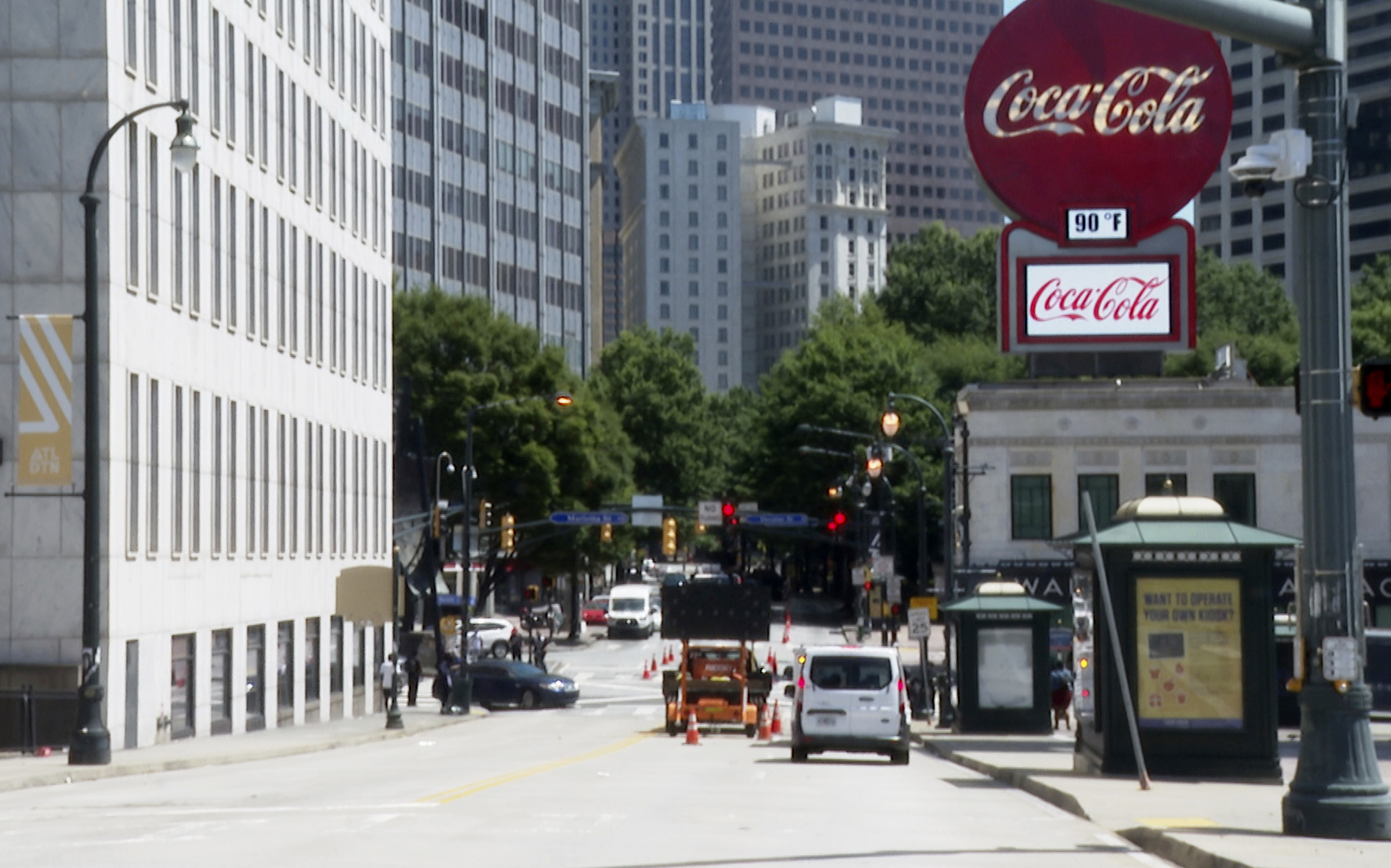 A view shows Peachtree Street in Atlanta on June 10, 2022. A large Coca-Cola sign stands in the far right corner of the photo.