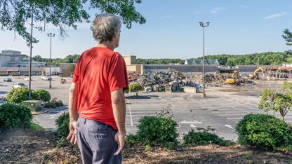 The long-awaited demolition of North DeKalb Mall had the air of a state funeral, as public officials past and present gathered Wednesday to say goodbye to one era of commercial development while celebrating the start of a new one.