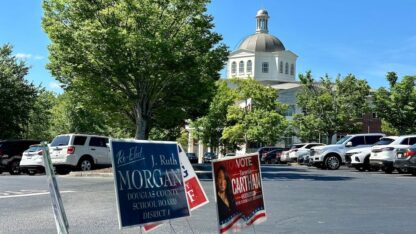 The Douglas County courthouse stands in the background.