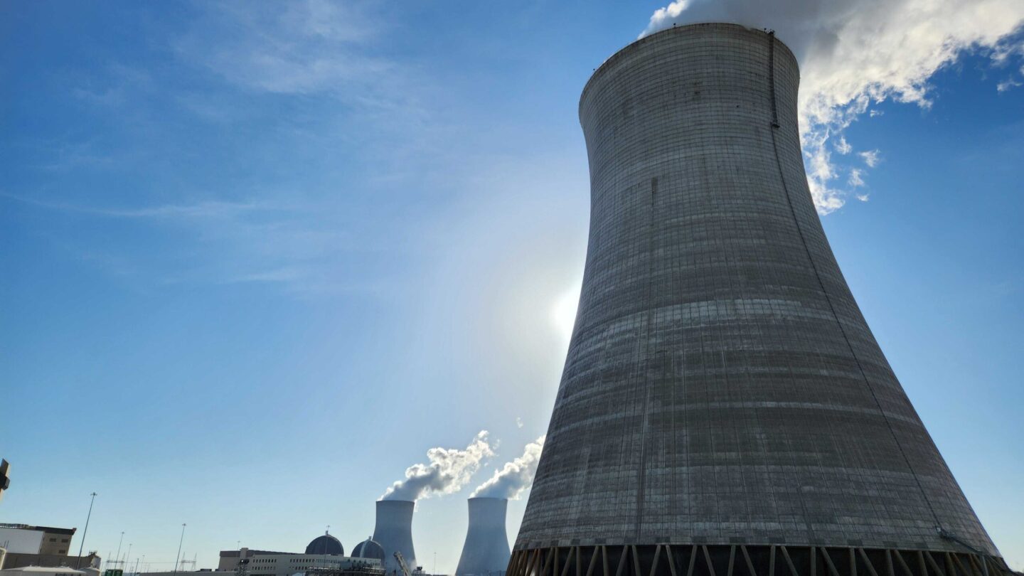 A thick funnel emits steam into a blue sky at Plant Vogtle in Waynesboro, Georgia, a four-unit nuclear power plant.