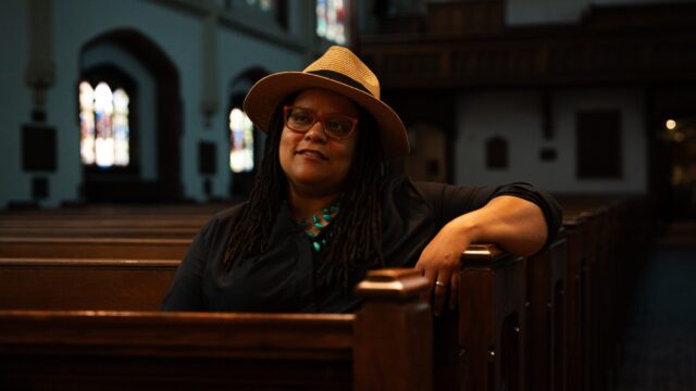 Kim Jackson, Georgia's first openly gay senator, sits in a pew at St. Luke's Episcopal Church in Atlanta.