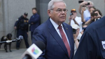 New Jersey Senator Bob Menendez is leaving federal court in New York, and microphones and cameras are pointed at him as he leaves.