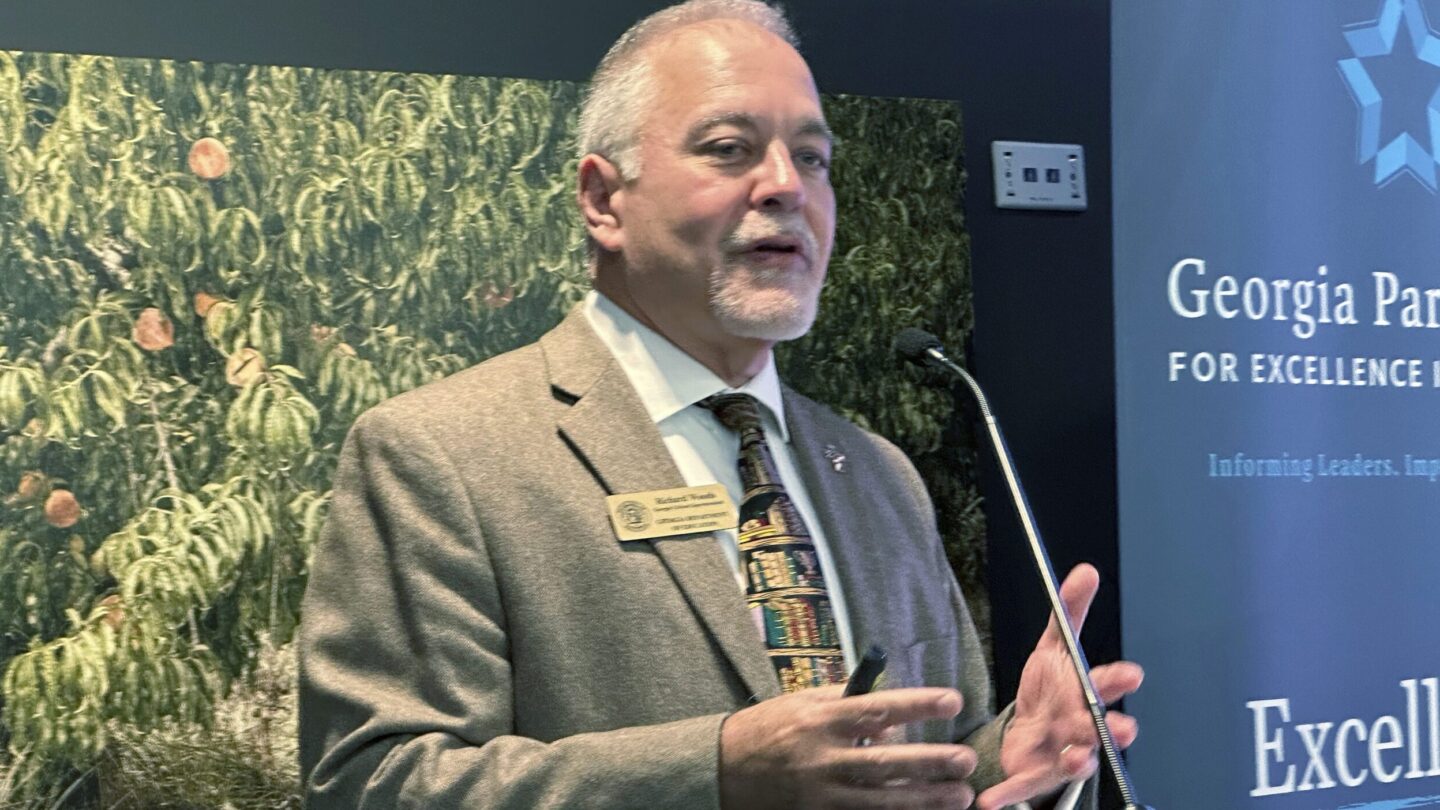 Georgia Superintendent of Schools Richard Woods speaks at a podium.