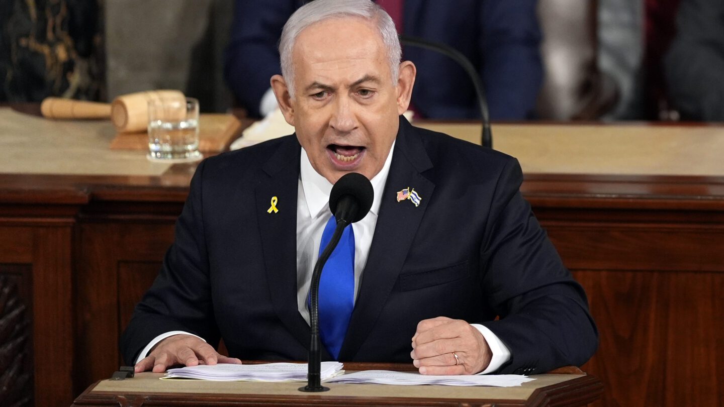 Israeli Prime Minister Benjamin Netanyahu speaks fervently with his fist on the podium at a joint meeting of Congress at the Capitol.