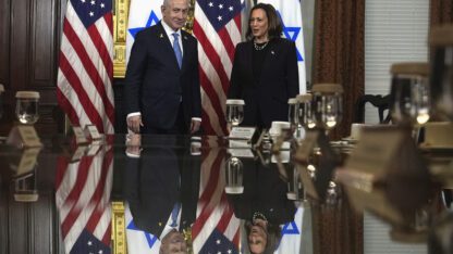 Vice President Kamala Harris, right, and Israeli Prime Minister Benjamin Netanyahu appear before a meeting at the Eisenhower Executive Office Building on the White House complex in Washington, Thursday, July 25, 2024. American and Israeli flags are behind them.