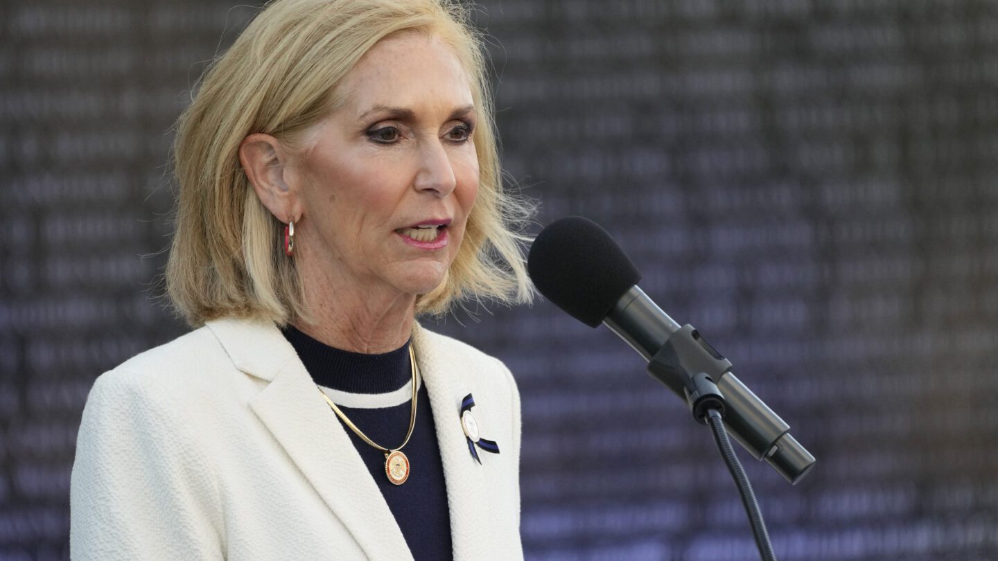 Mississippi Attorney General Lynn Fitch speaks into a microphone at the Mississippi Fallen Officers Candlelight Vigil at the Capitol Complex in Jackson, Miss.