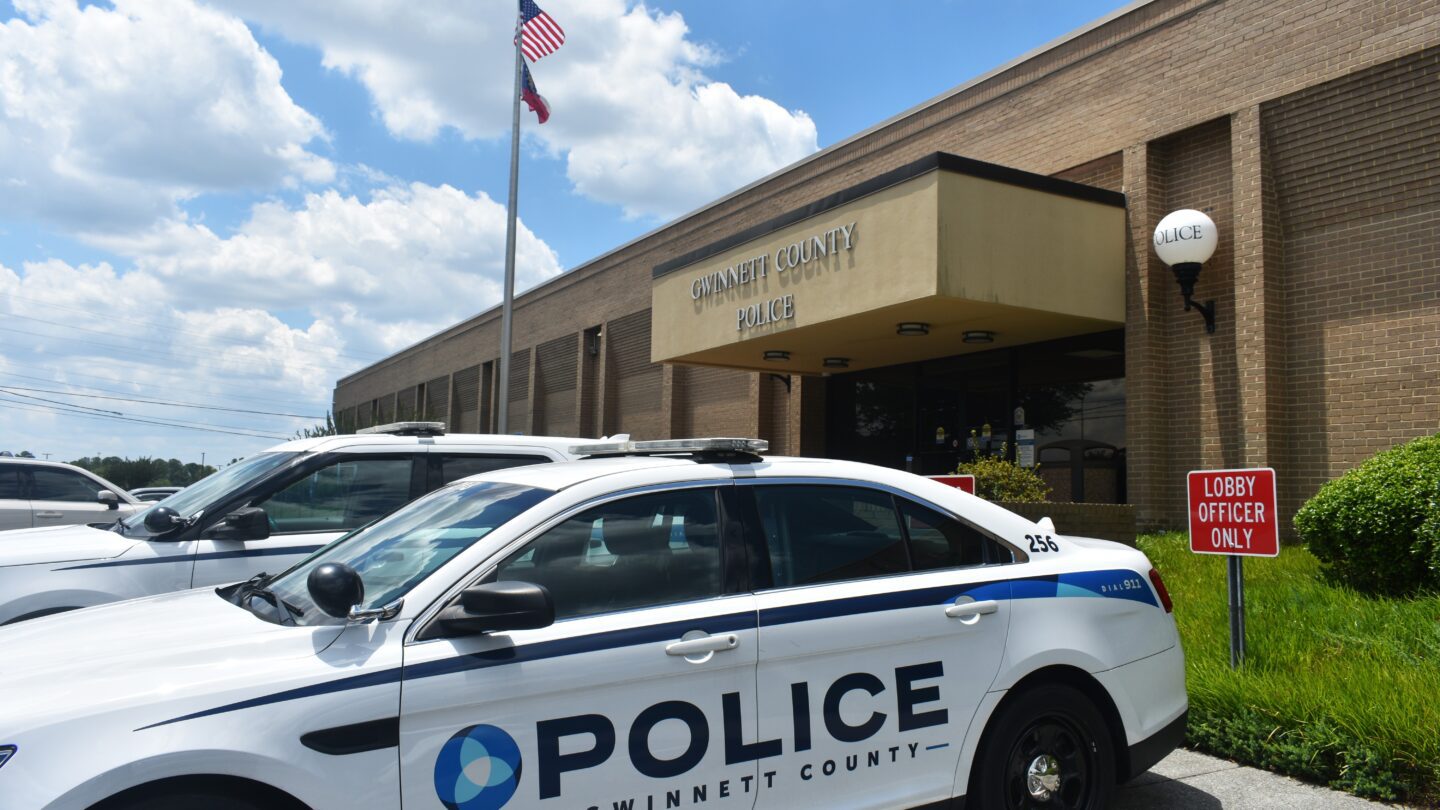 Police car parked in front of station