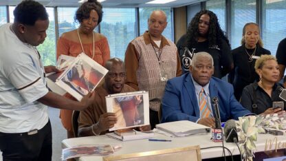 The family of U.S. Army veteran Christon Collins shows multiple photos of the bruises on his body at a press conference.