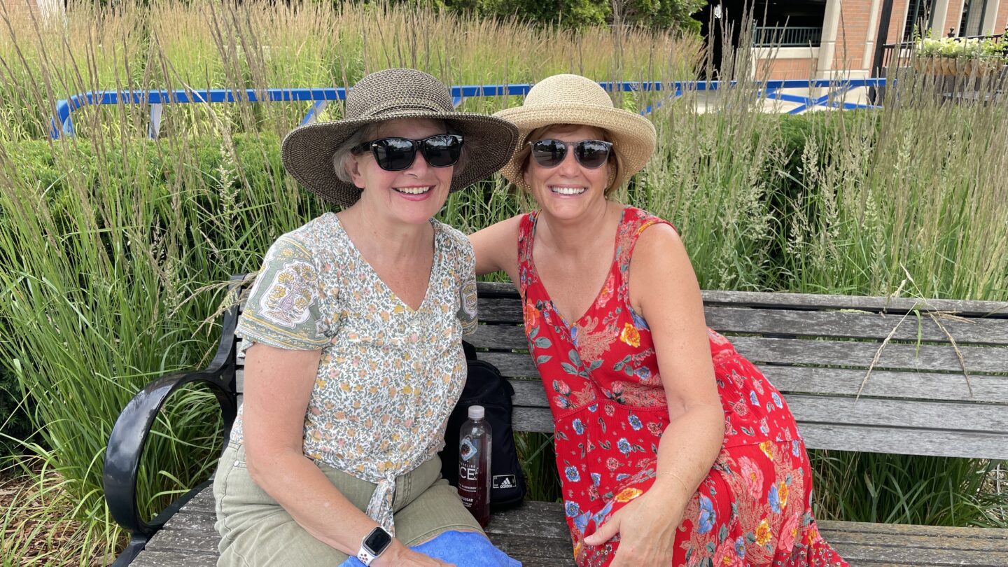 Two women on bench outside