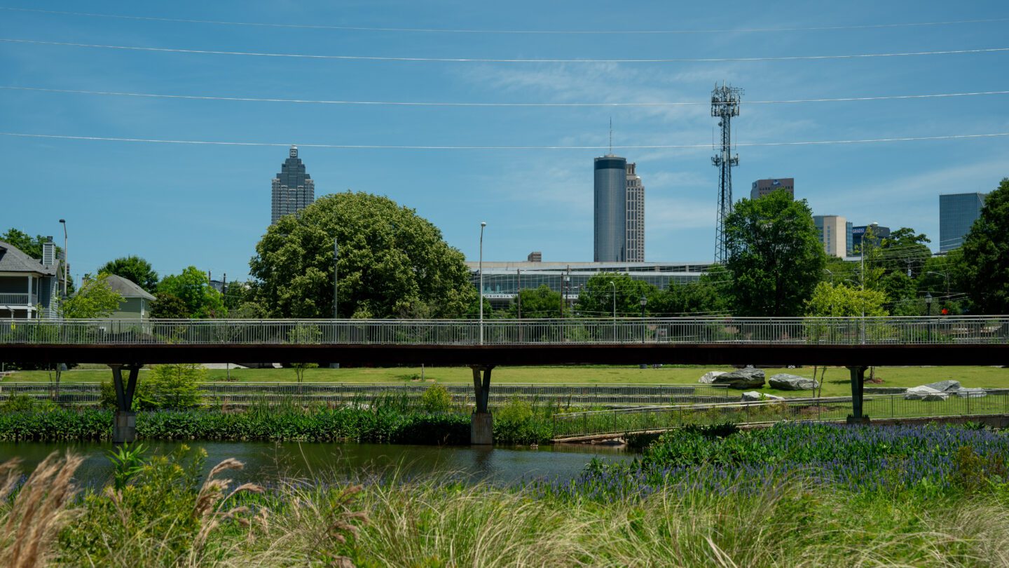 A walkway through Cook Park crosses the stormwater retention pond. (Matthew Pearson/WABE News)