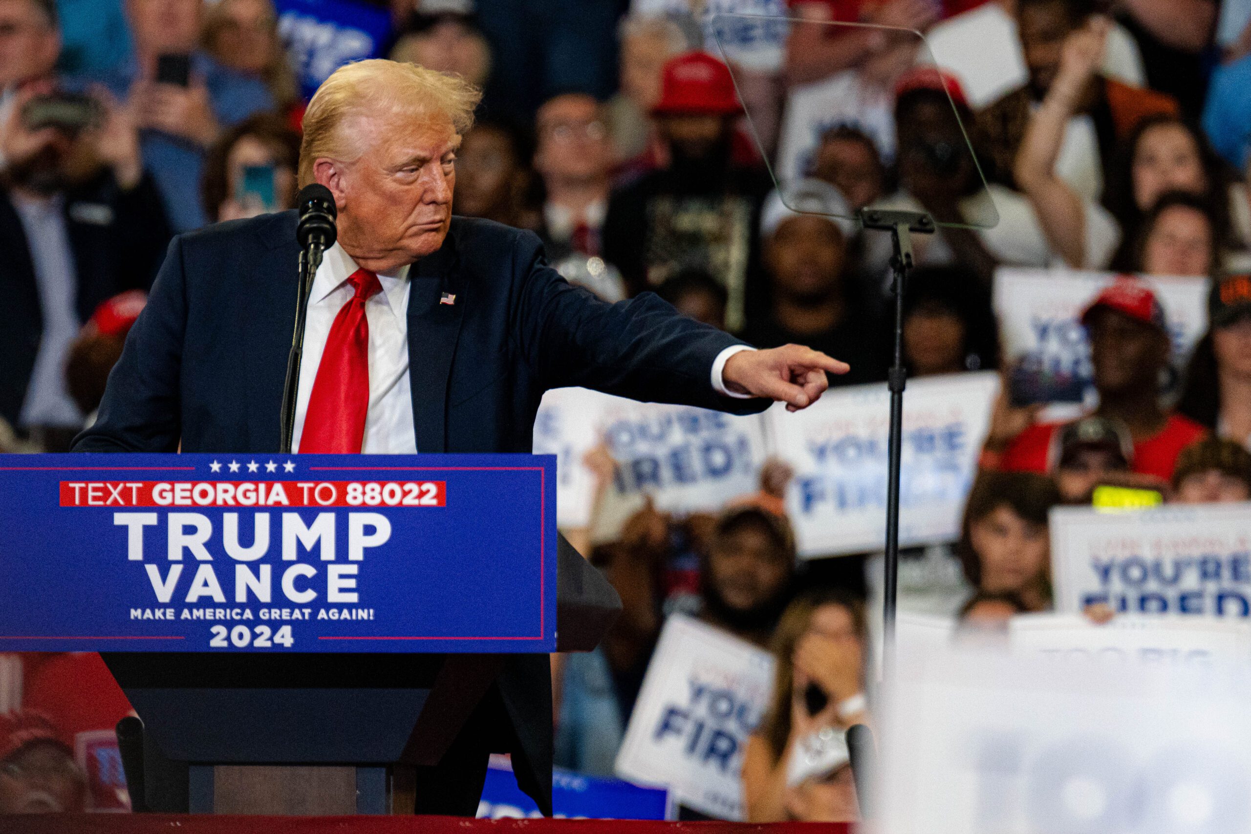 Former President Donald Trump points at the crowd at his campaign rally in Atlanta on Saturday, Aug. 3, 2024.