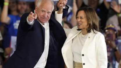 Democratic presidential nominee Vice President Kamala Harris and running mate Minnesota Gov. Tim Walz arrive at a campaign rally Wednesday, Aug. 7, 2024, in Romulus, Mich.