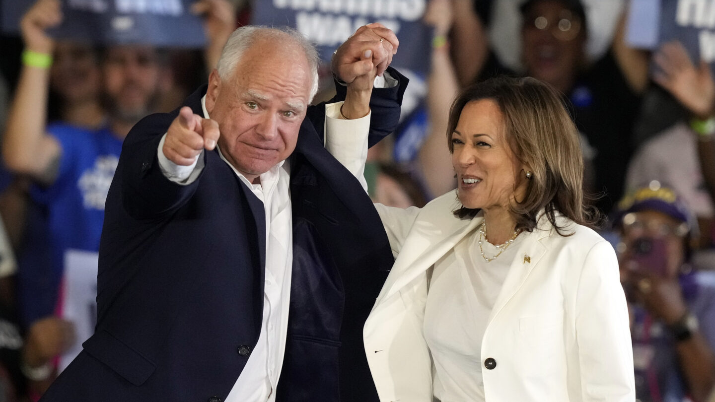 Democratic presidential nominee Vice President Kamala Harris and running mate Minnesota Gov. Tim Walz arrive at a campaign rally Wednesday, Aug. 7, 2024, in Romulus, Mich.