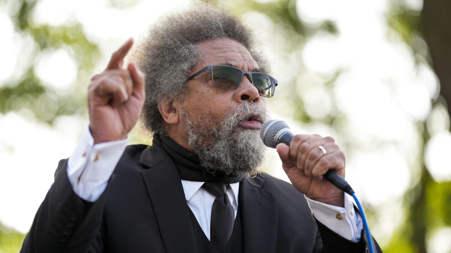 Cornel West speaks into a microphone.