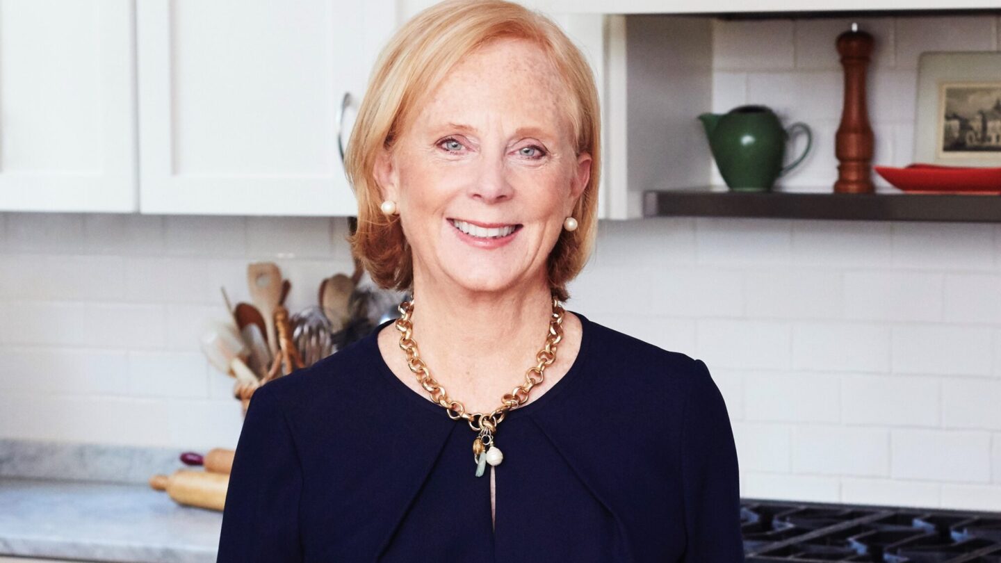 Anne Byrn stands in a kitchen.