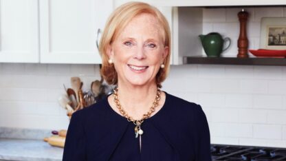 Anne Byrn stands in a kitchen.