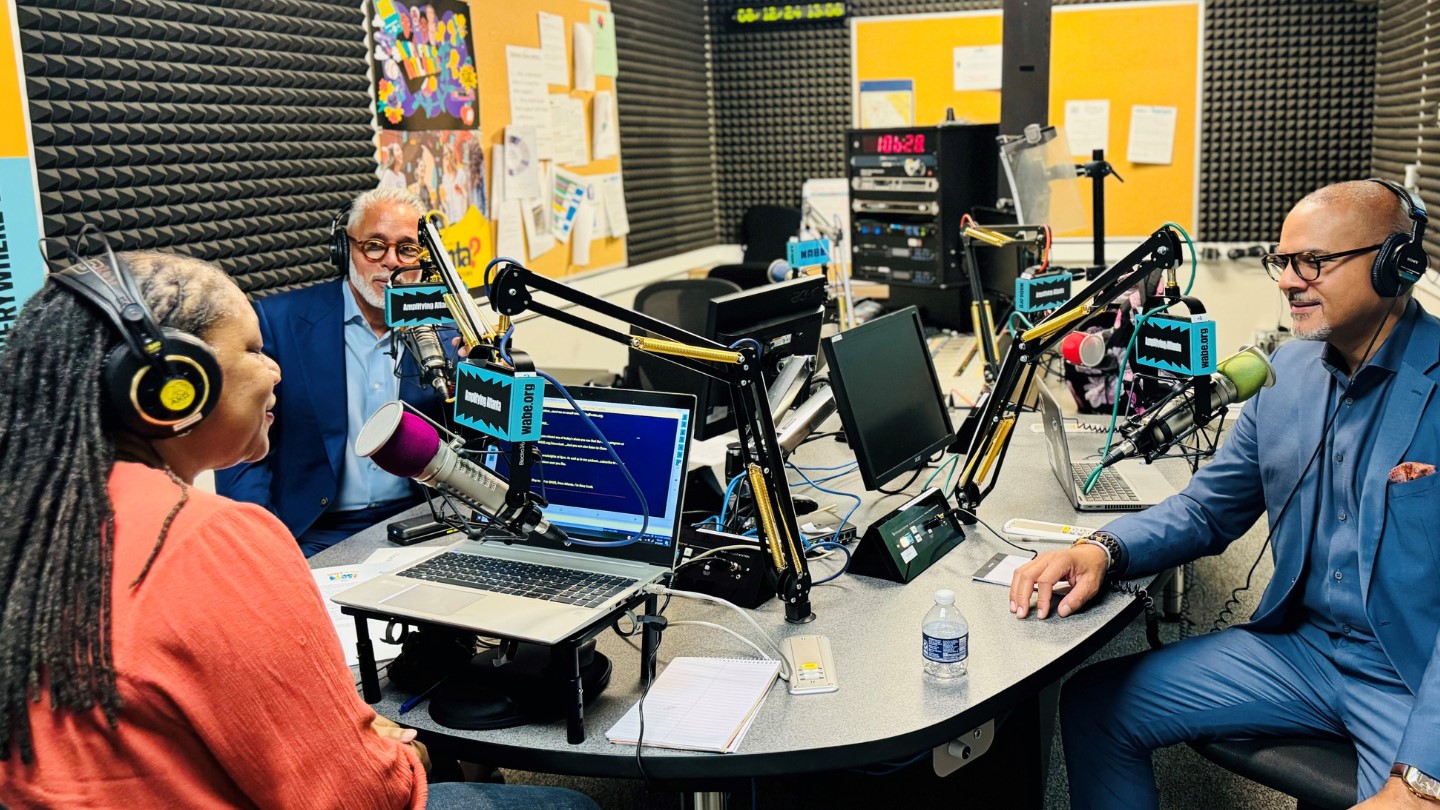 From left to right: Vince Velazquez, Closer Look show host Rose Scott, and David Quinn sit in the WABE studio.