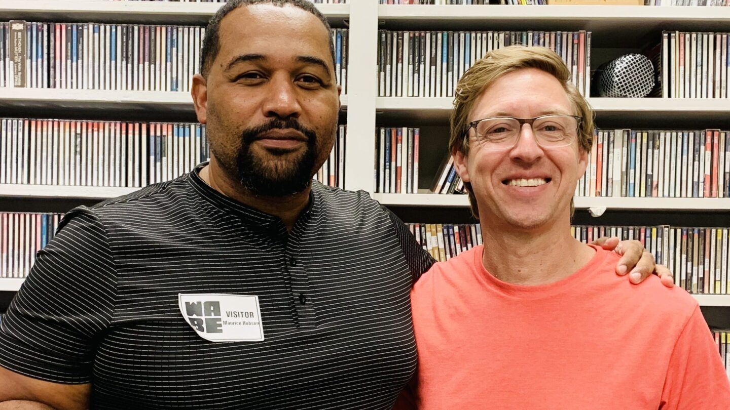 Atlanta historian and Georgia State University professor Maurice Hobson and Jeff Keating of Doghouse Pictures pose in front of a bookshelf.