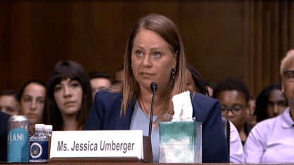 Jessica Umberger of Atlanta testifies about her experience giving birth in prison at Wednesday's Senate subcommittee hearing. Onlookers sit behind her.