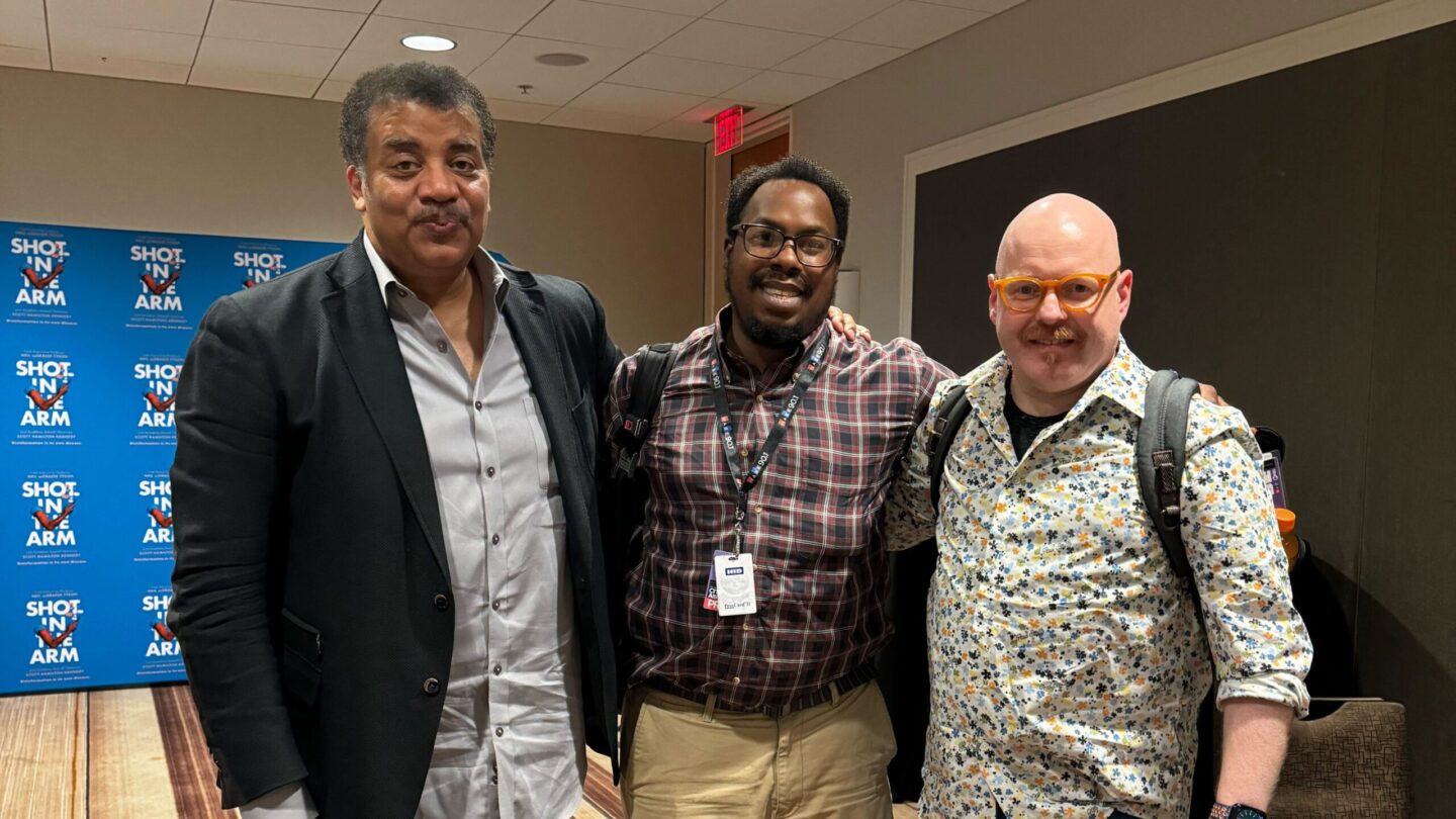 Shot in the Arm executive producer Neil deGrasse Tyson, left, poses with All Things Considered producer Christopher Alston, center, and host Jim Burress.