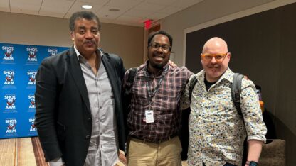 Shot in the Arm executive producer Neil deGrasse Tyson, left, poses with All Things Considered producer Christopher Alston, center, and host Jim Burress.