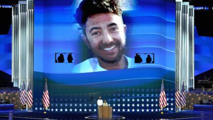 Hersh Goldberg-Polin, an Israeli American held hostage by Hamas, is pictured on screen at the Democratic National Convention.