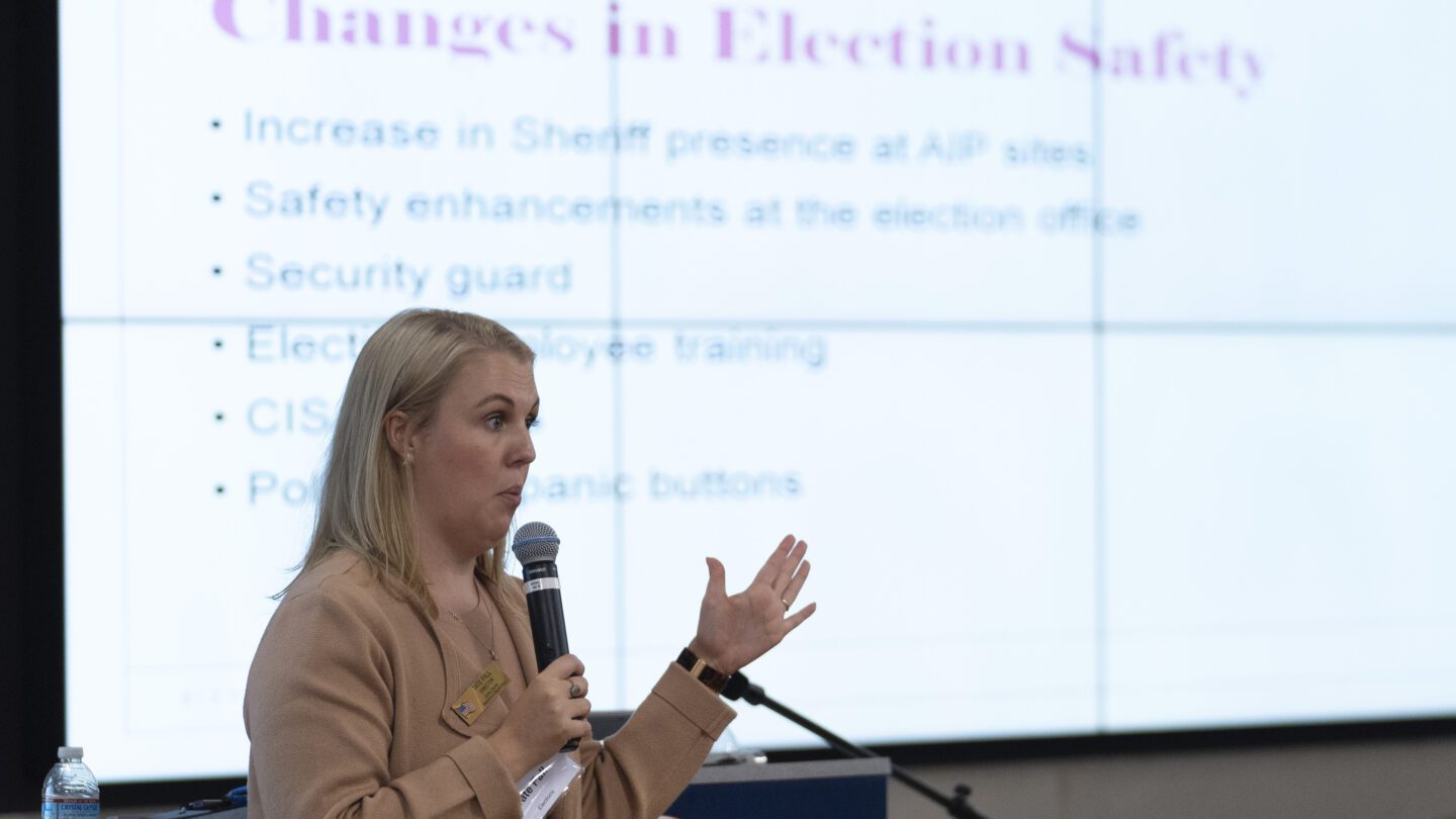 Tate Fall, director of Cobb County Elections, speaks in front of a projected slide during an election security training session at Cobb County Emergency Management headquarters Aug. 23, 2024, in Marietta.