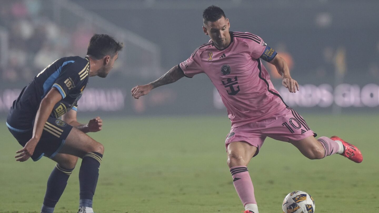 Lionel Messi kicks ball away from Leon Flach during MLS soccer match in Florida.