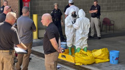 A hazmat crew from the National Guard's Civilian Support Team investigates after a suspicious package was delivered to election officials at the Missouri Secretary of State's Jefferson City, Mo., office on Tuesday Sept. 17, 2024.