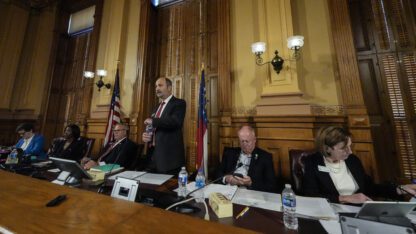 Georgia's State Election Board members discuss proposals for election rule changes at the state Capitol