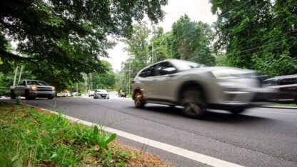 A car speeding by on a road.