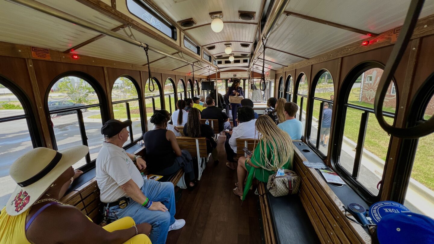 Residents ride the trolley