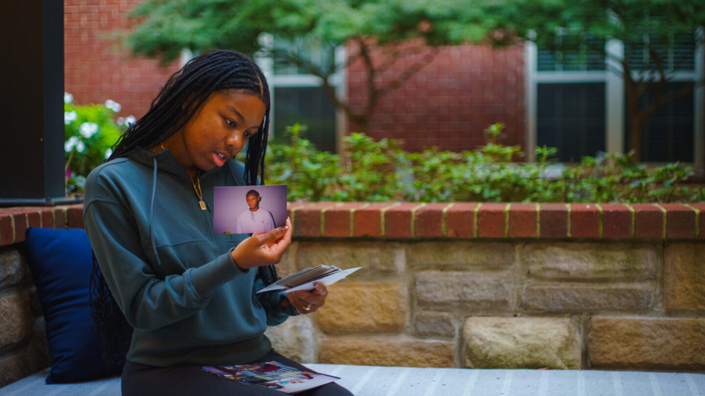 Marina Melendez looks at a photo of her father, both of whom are Afro Latino