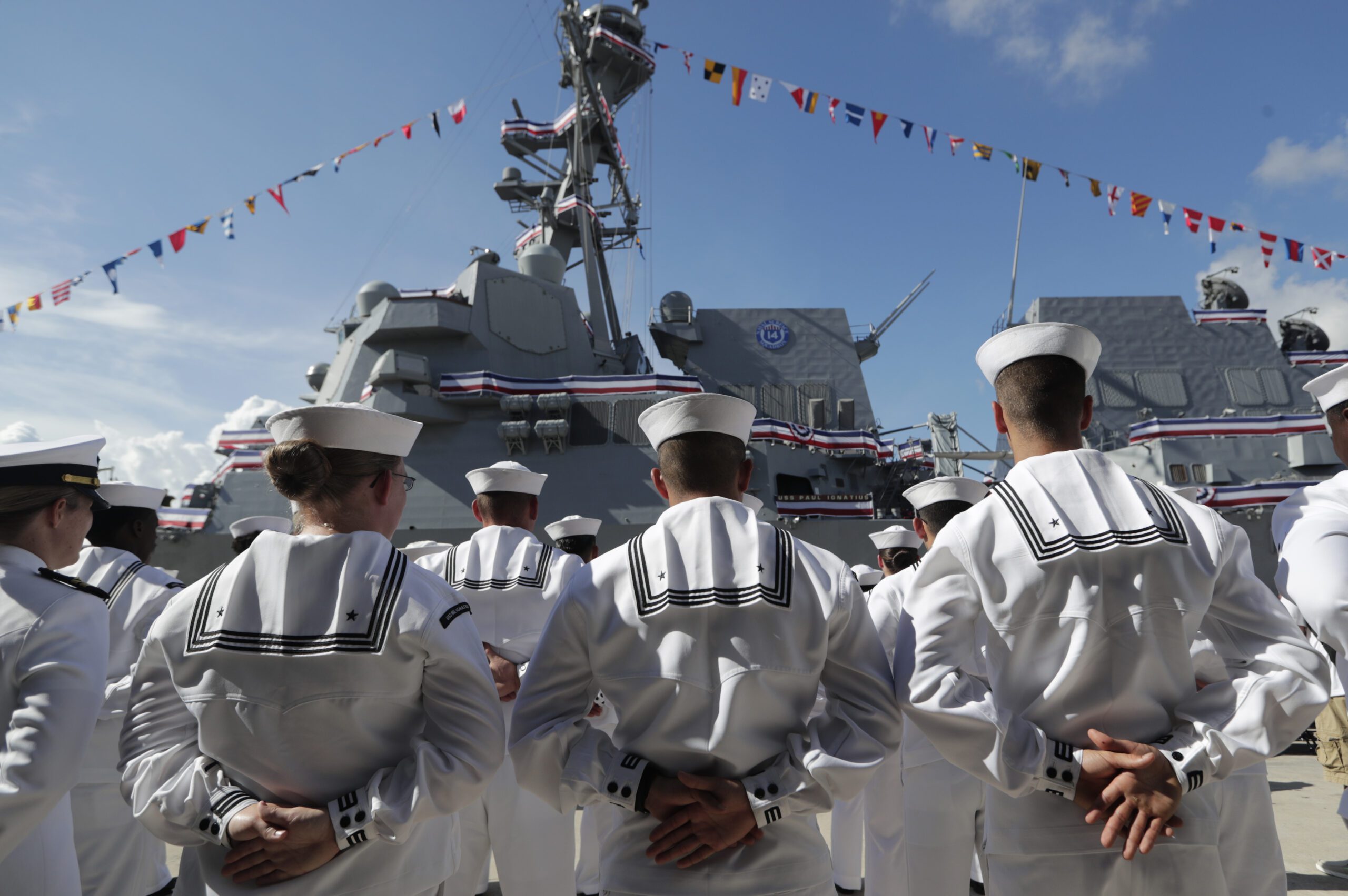 Sailors stand in front of a U.S. Navy guided missile destroyer USS Paul Ignatius at Port Everglades in Florida.