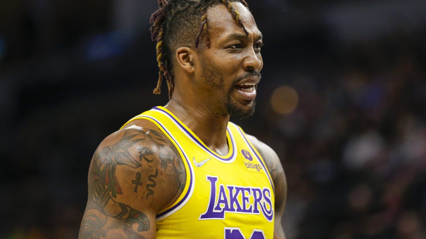 Los Angeles Lakers center Dwight Howard looks on during an NBA basketball game.