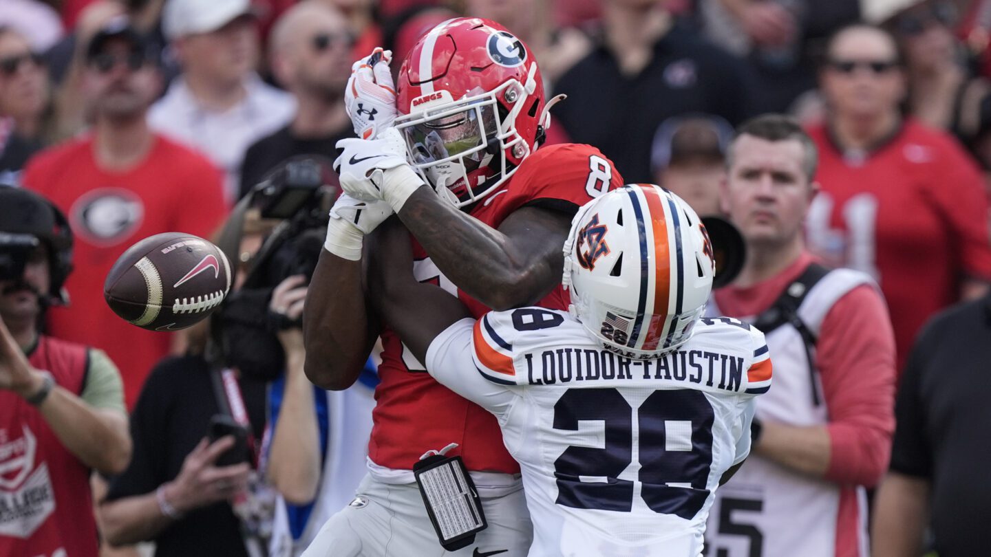 Auburn safety Kensley Louidor-Faustin breaks up a pass intended for Georgia wide receiver Colbie Young in the first half of an NCAA college football game Saturday, Oct. 5, 2024, in Athens, Ga.